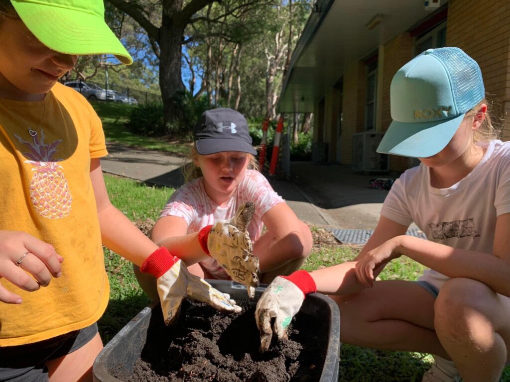 kids getting the soil ready